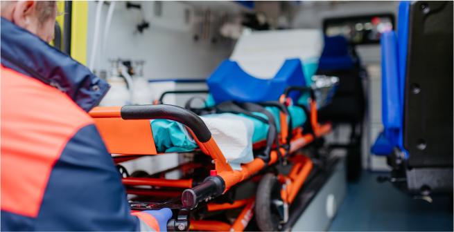 Paramedic treating a patient in an ambulance