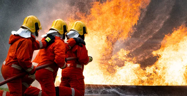 Firefighters tackling a live structure fire